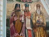 Фрагмент розпису апсиди Всіхсвятського приділу. Ікона «Святі Слобожанщини. Священномученик Онуфрій, Святитель Іоасаф Бєлгородський, Святитель Афанасій Лубенський». Липень 2022 року.