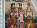 Фрагмент розпису апсиди Всіхсвятського приділу. Ікона «Святі Слобожанщини. Священномученик Онуфрій, Святитель Іоасаф Бєлгородський, Святитель Афанасій Лубенський». Липень 2022 року.